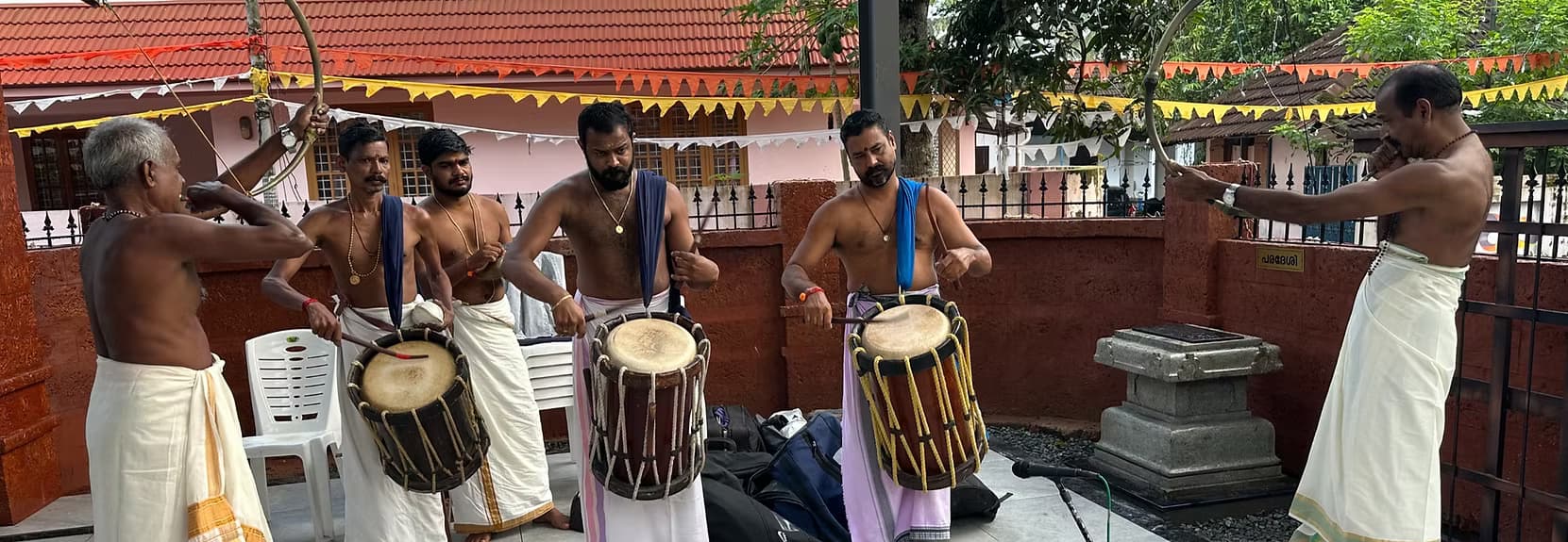 Annavi Saraswathi Temple pathway surrounded by lush greenery